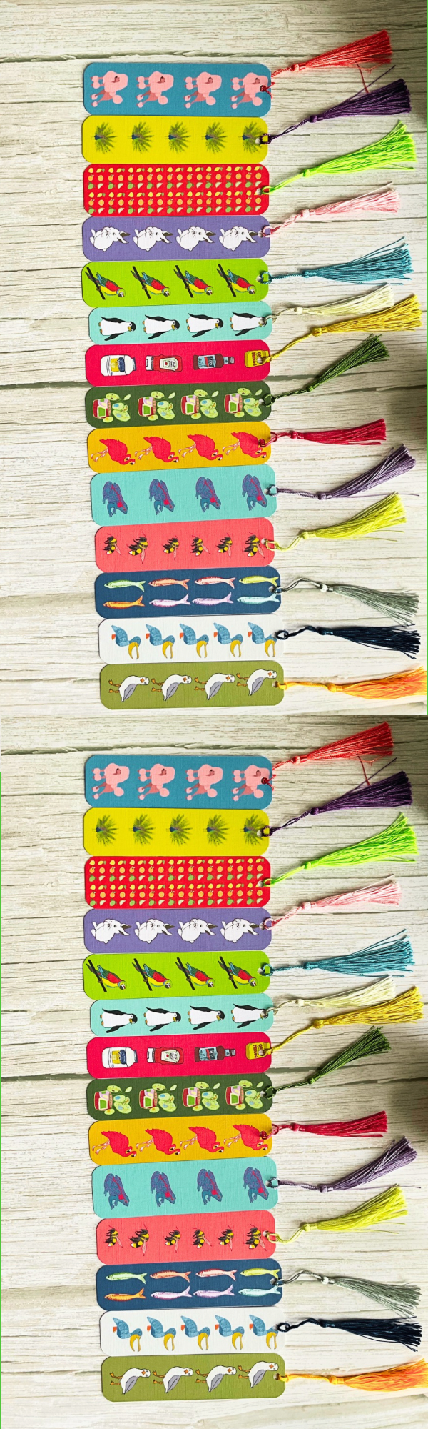 Colourful printed bookmarks with tassels on a wooden surface