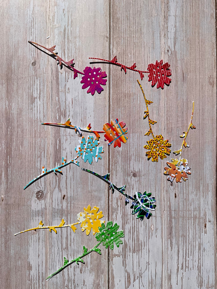 Cut die floral vinyl stickers in vibrant colours and patterns on a wooden table