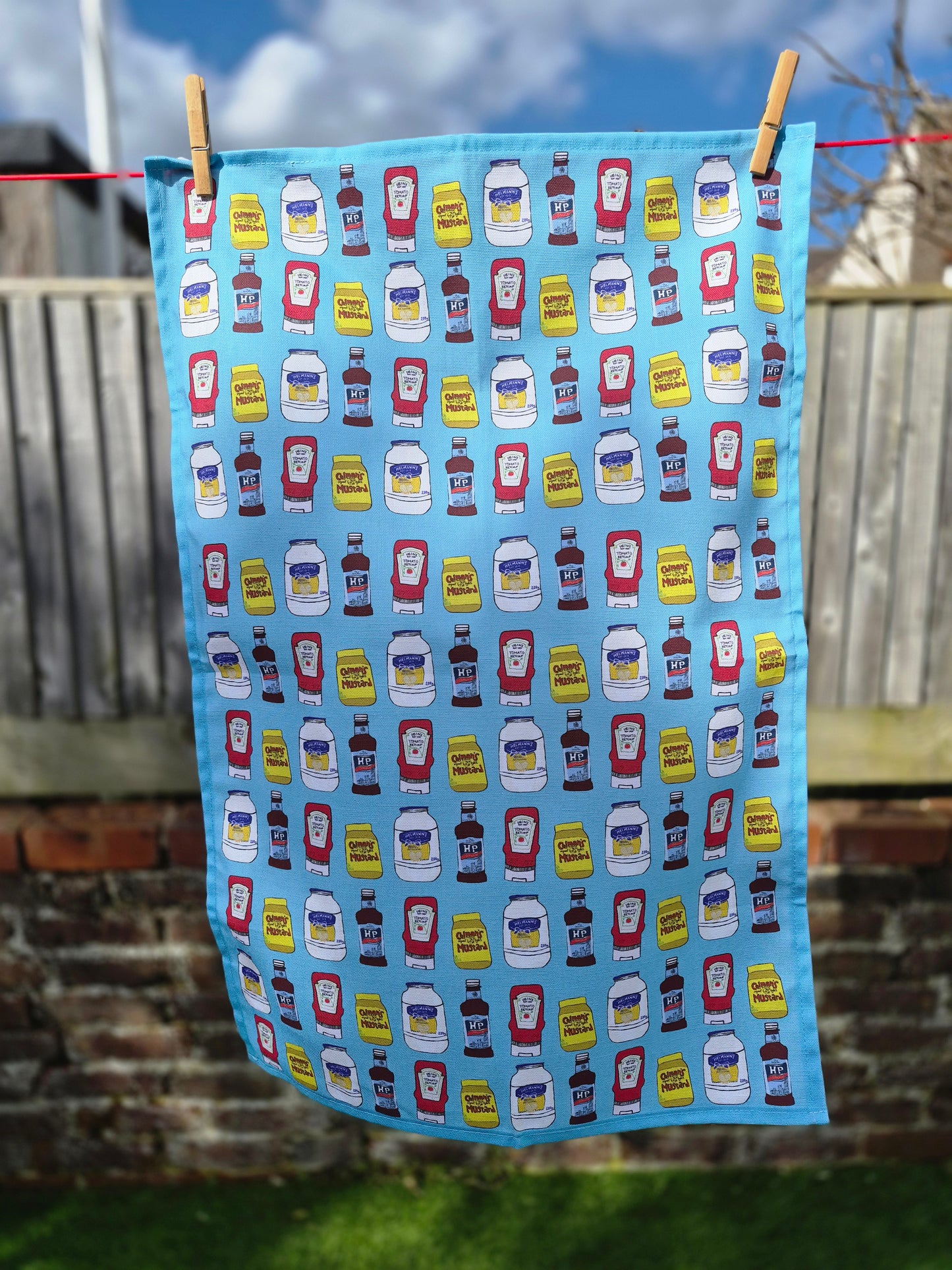 Condiment tea towel with hand-illustrated sauce bottles