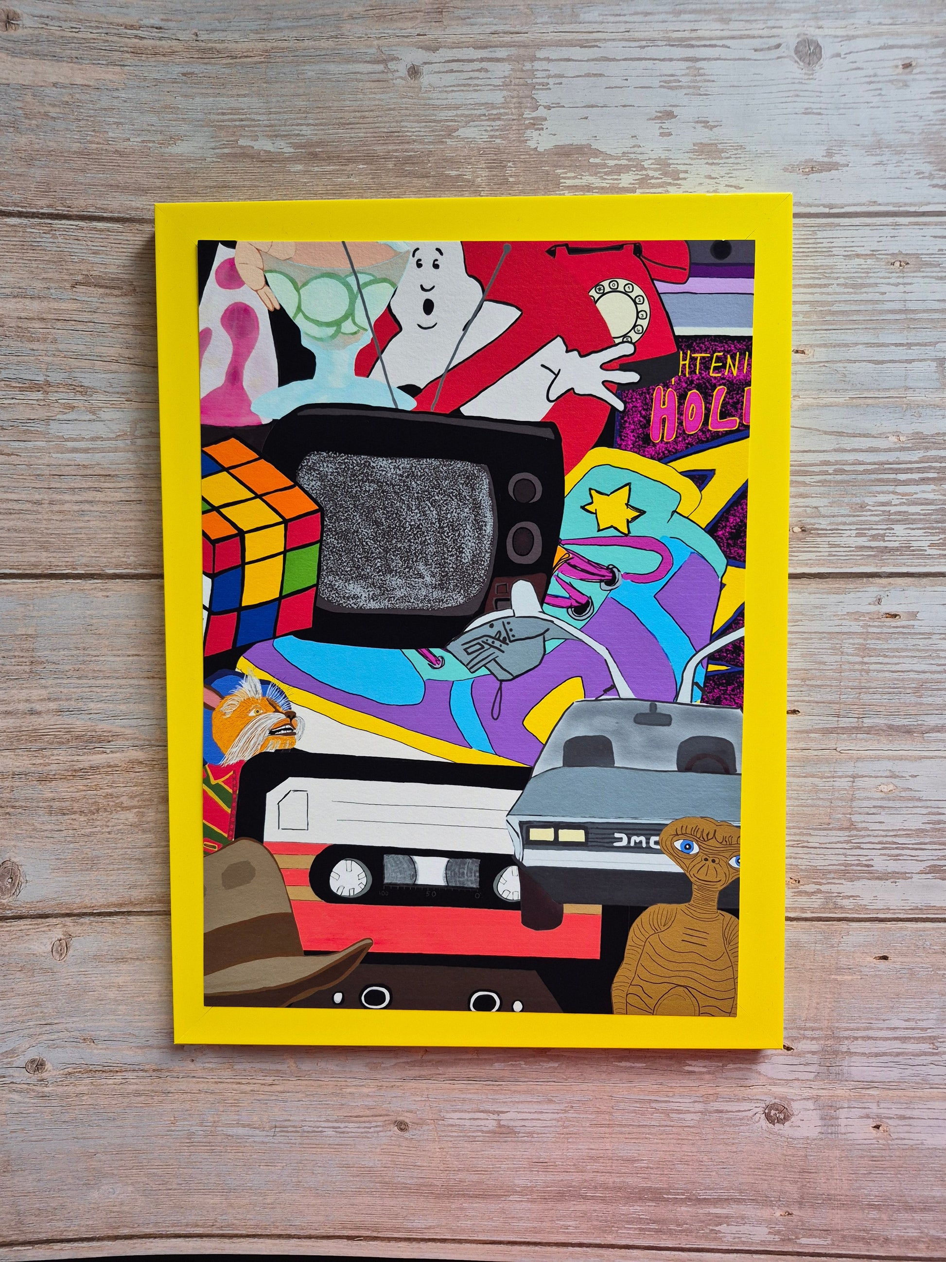 80s collage print in a yellow frame