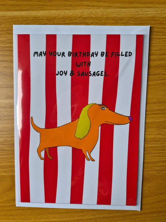 Cartoon dog birthday card on a red and white striped background with text