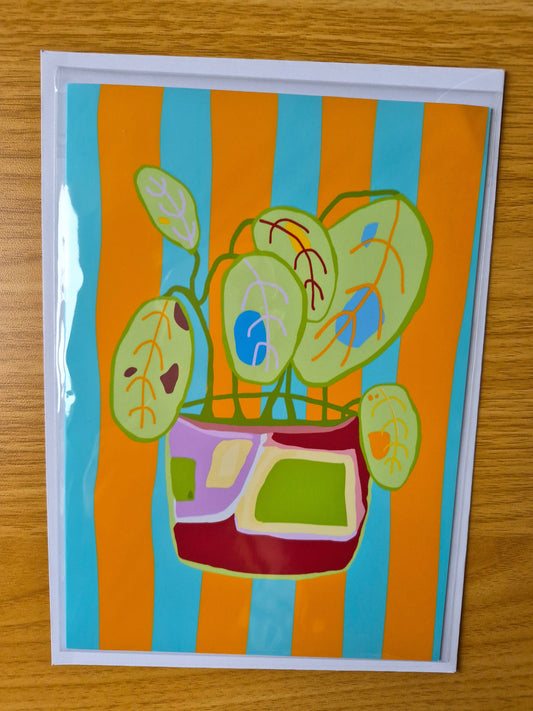 Colourful botanical greetings card with a plant pot design on an orange and blue striped background.