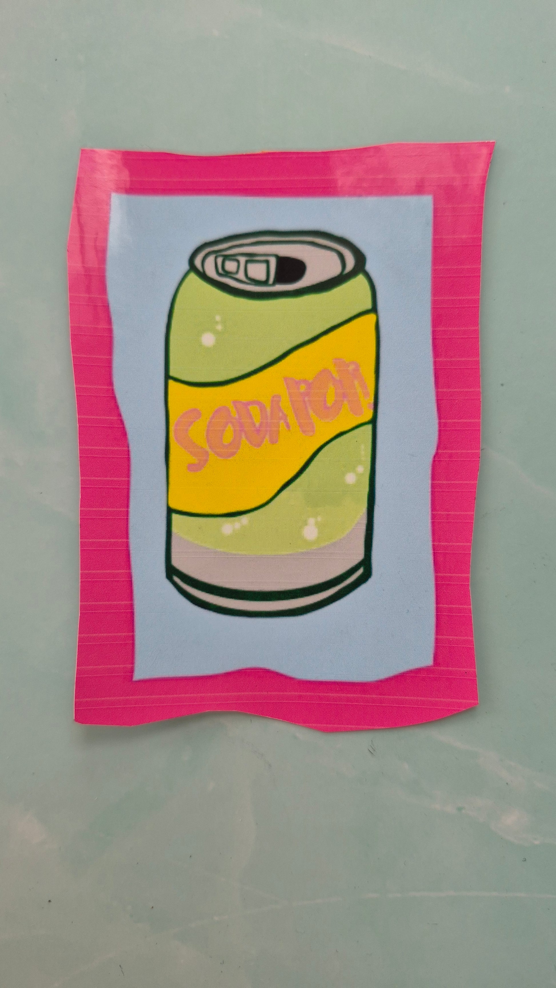 Rectangular vinyl sticker with a soda can design
