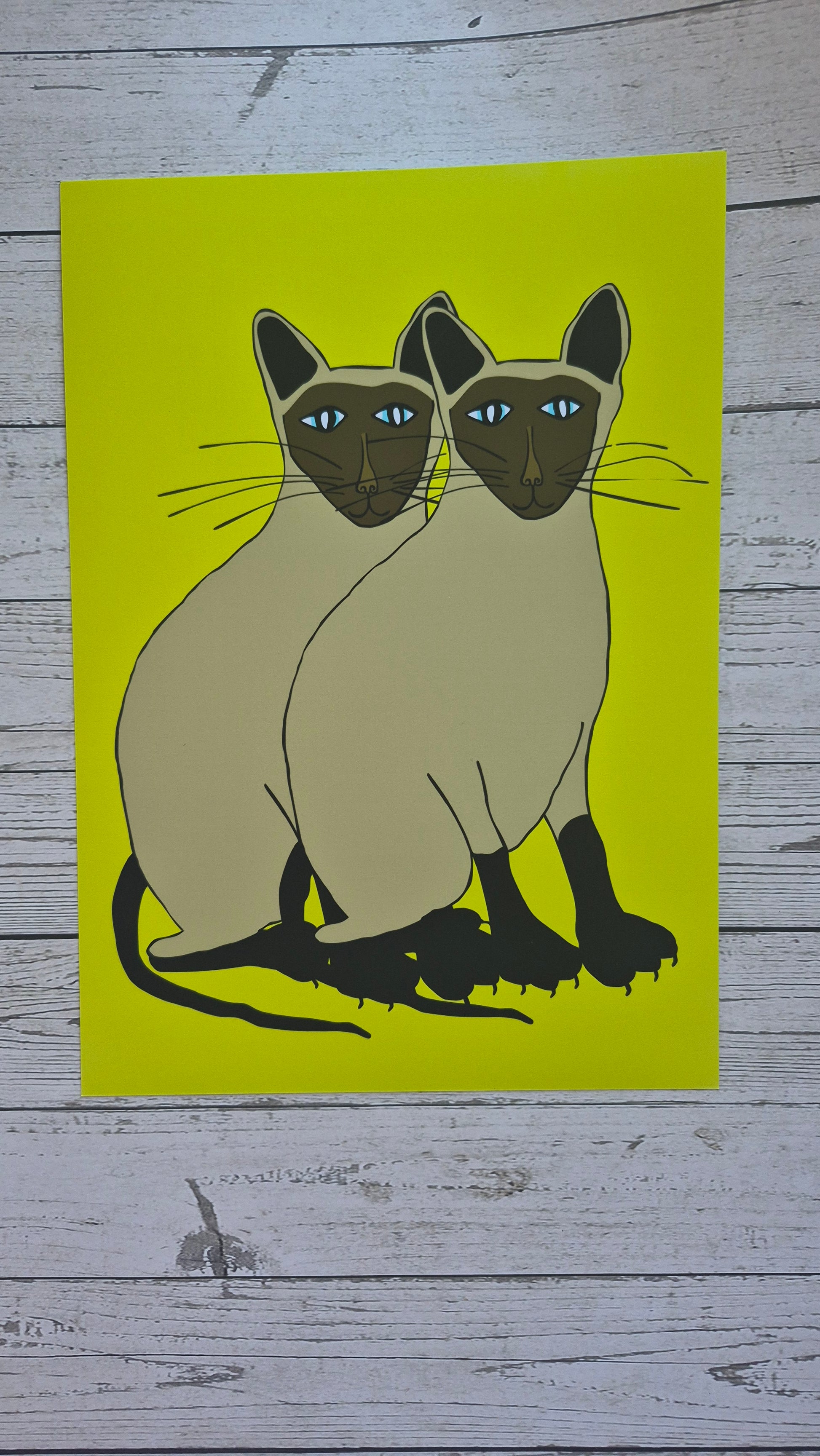 Illustration of two Siamese cats on a lime green  background