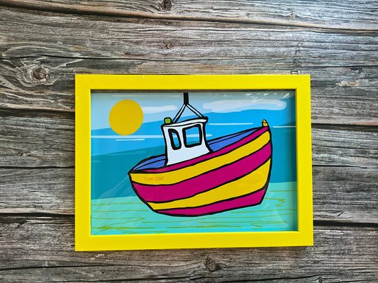 Colorful boat illustration in a yellow frame on a wooden background