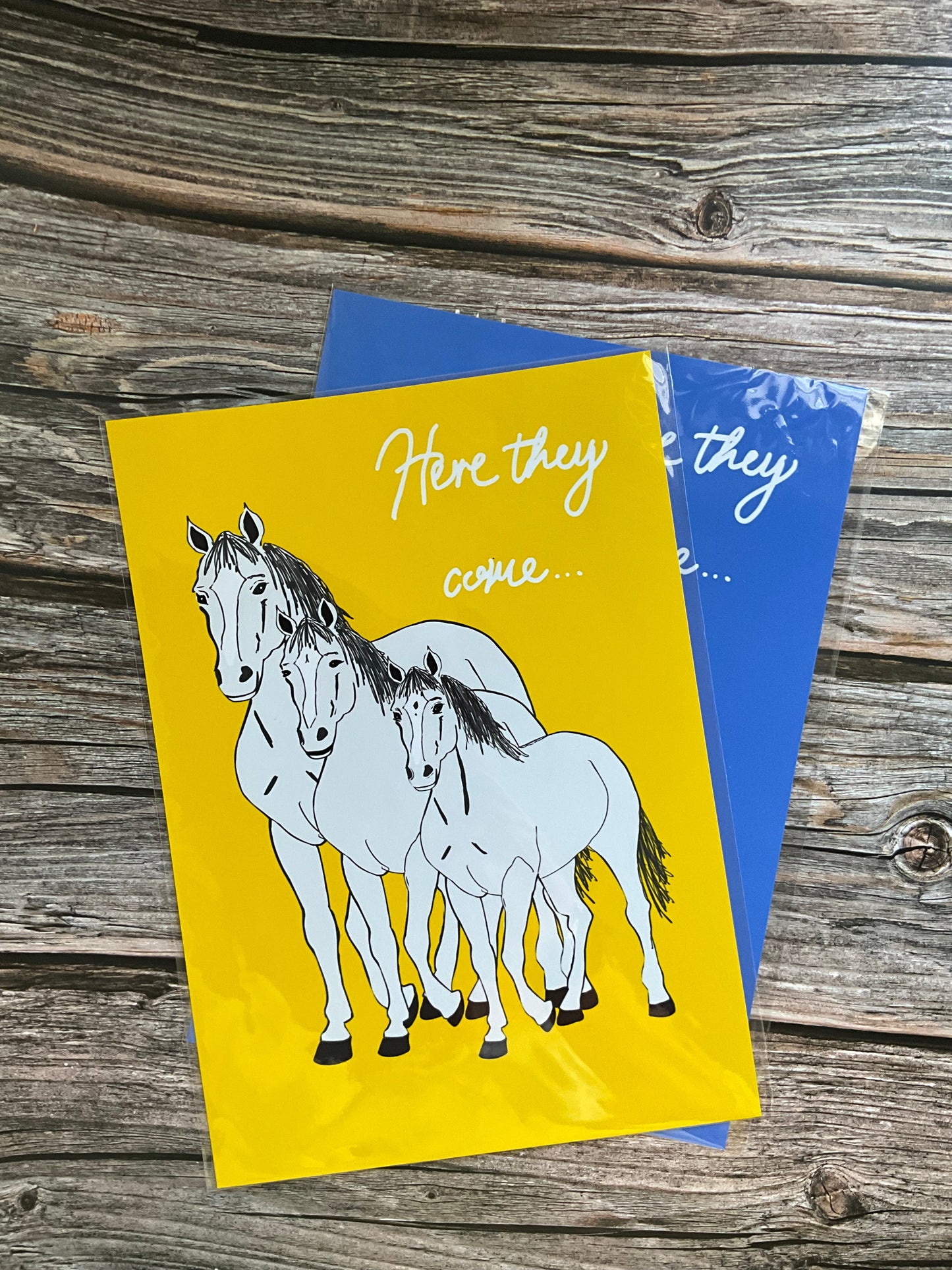 Horse wall art print - white horses and yellow background with the song lyric ‘here they come’