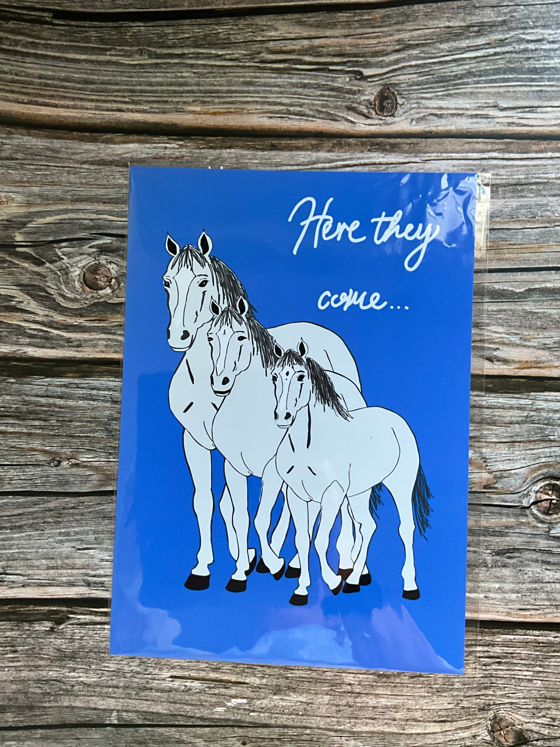 Horse wall art print - white horses and blue background with the song lyric ‘here they come’