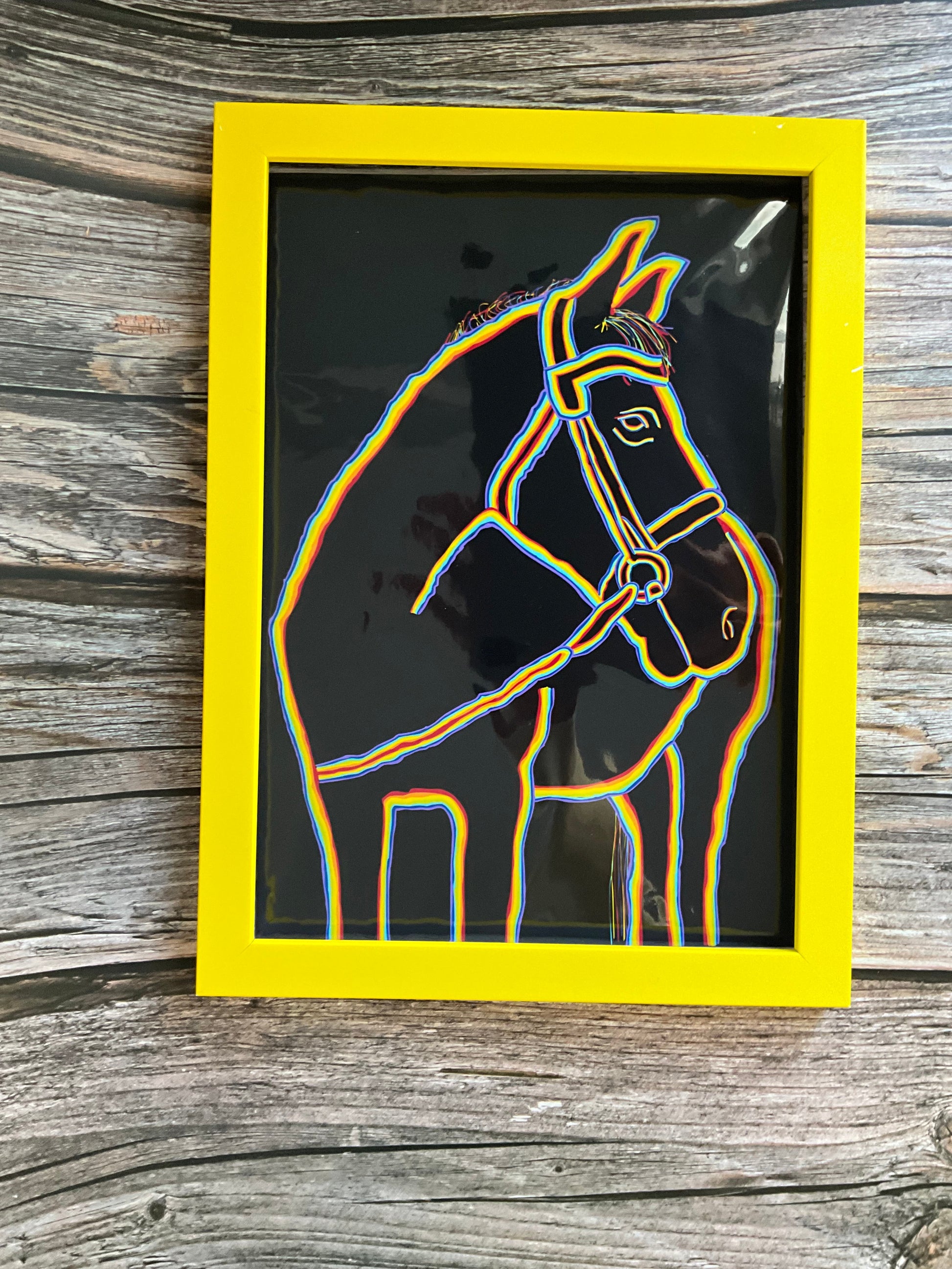 Horse art print - rainbow outline with a black background in a yellow fram