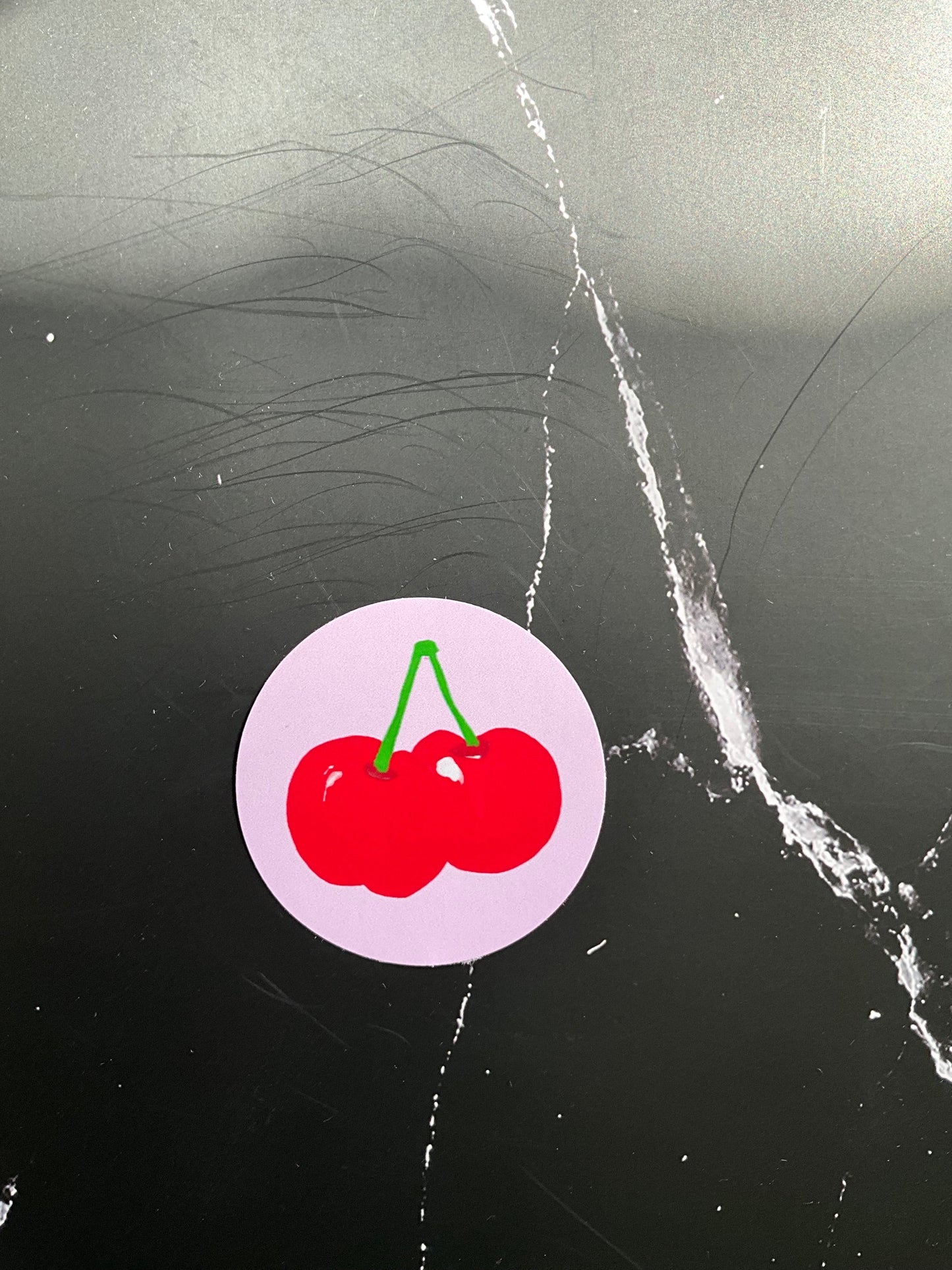Pale pink round vibrant sticker featuring cherries on stalks illustration