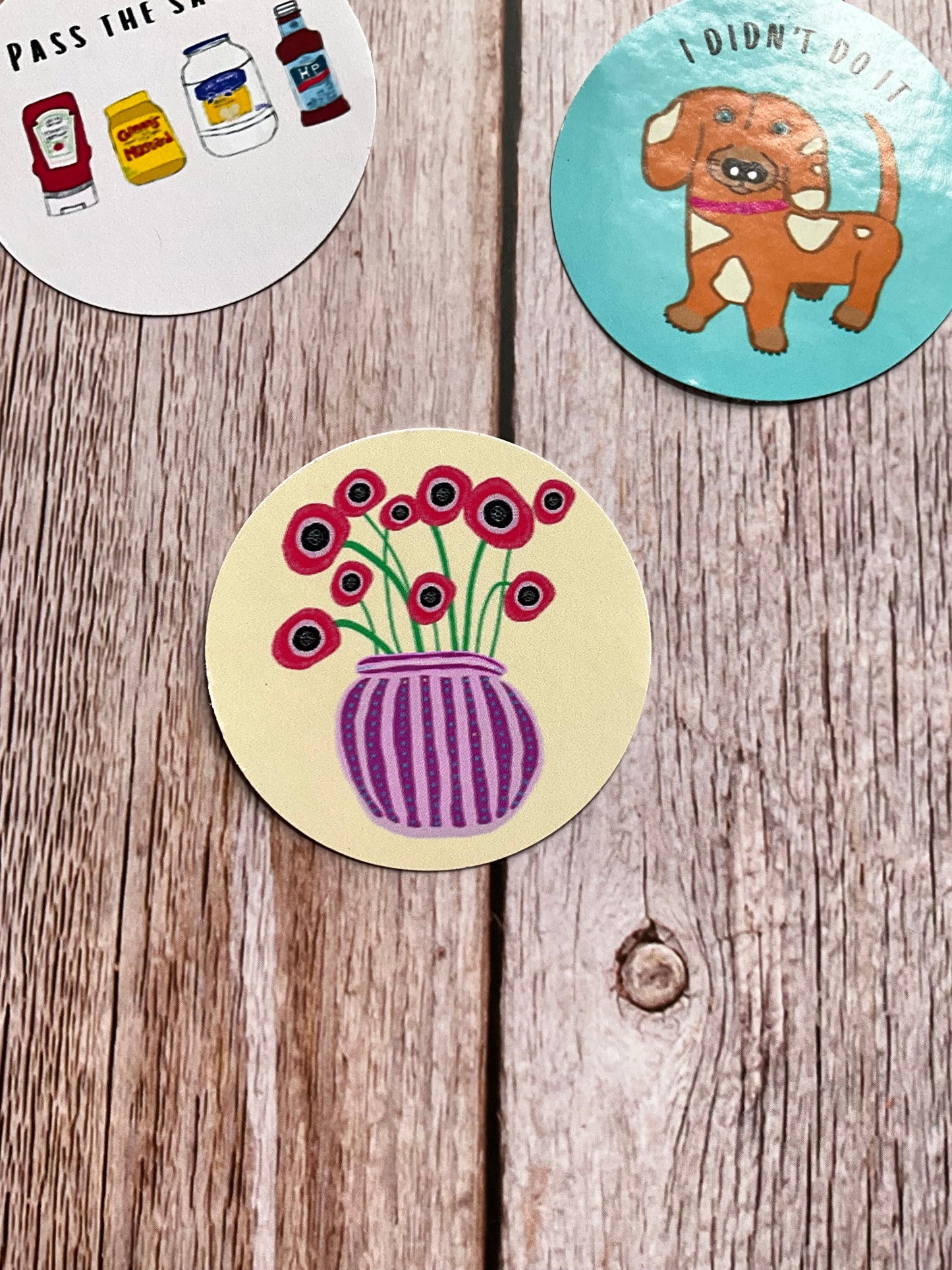 Cream vinyl sticker featuring a vase of red poppies - abstract and colourful design