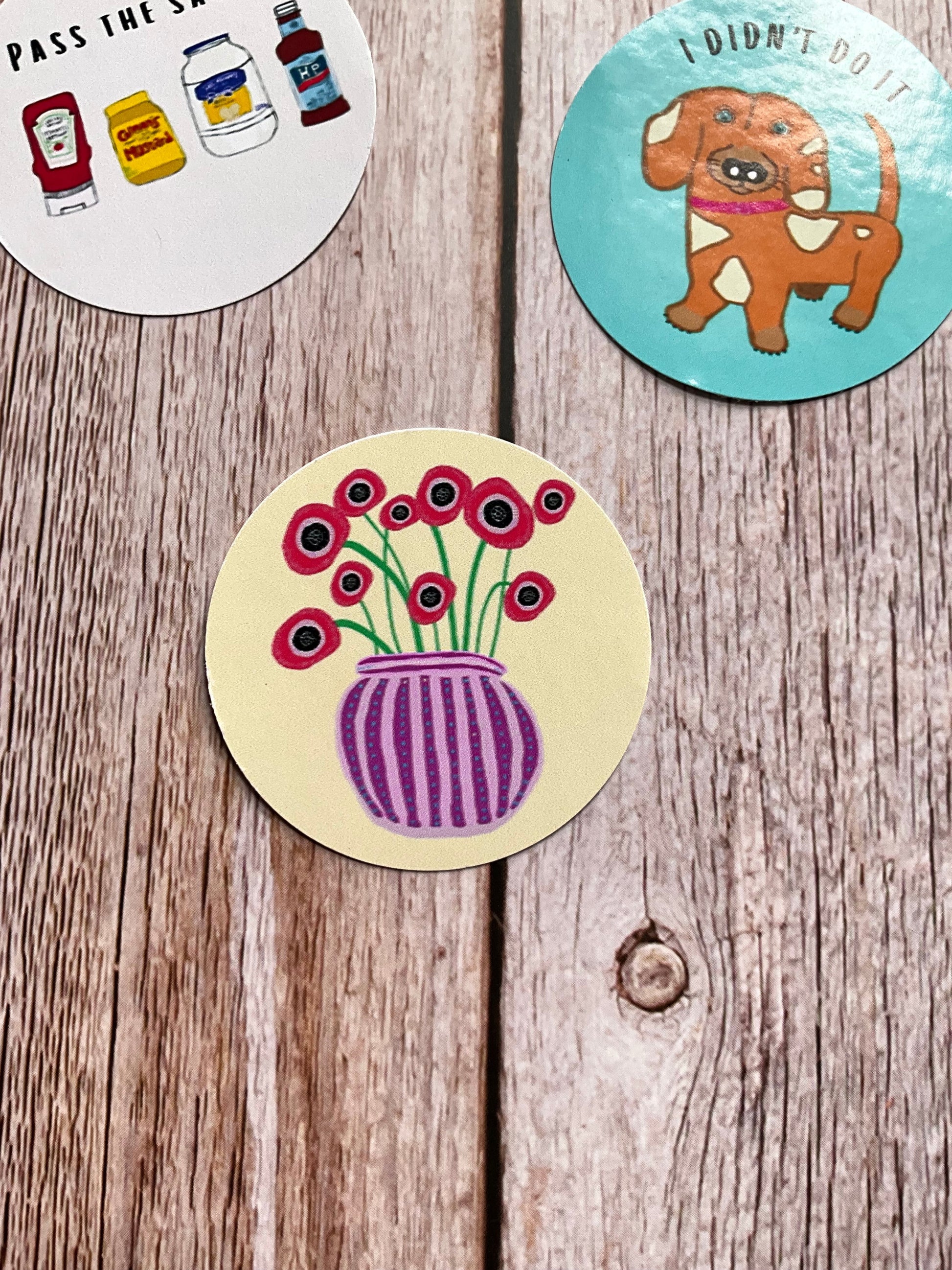 Cream vinyl sticker featuring a vase of red poppies - abstract and colourful design