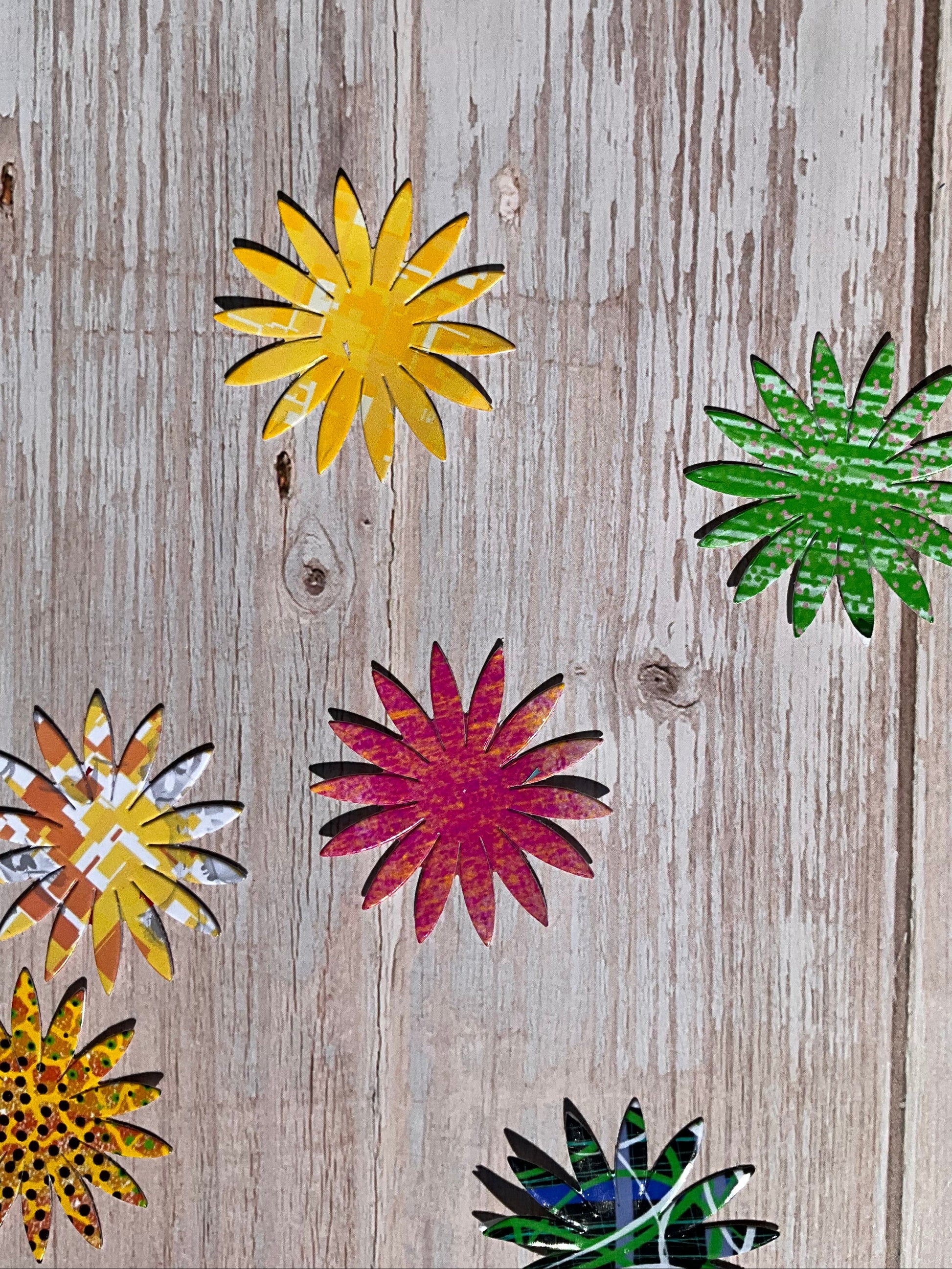 Colourful sunflower vinyl stickers on a wooden table