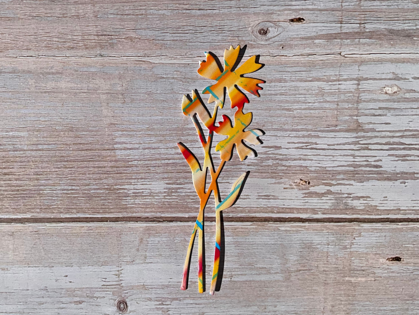 Pink and orange patterned vinyl sticker in the shape of cornflowers