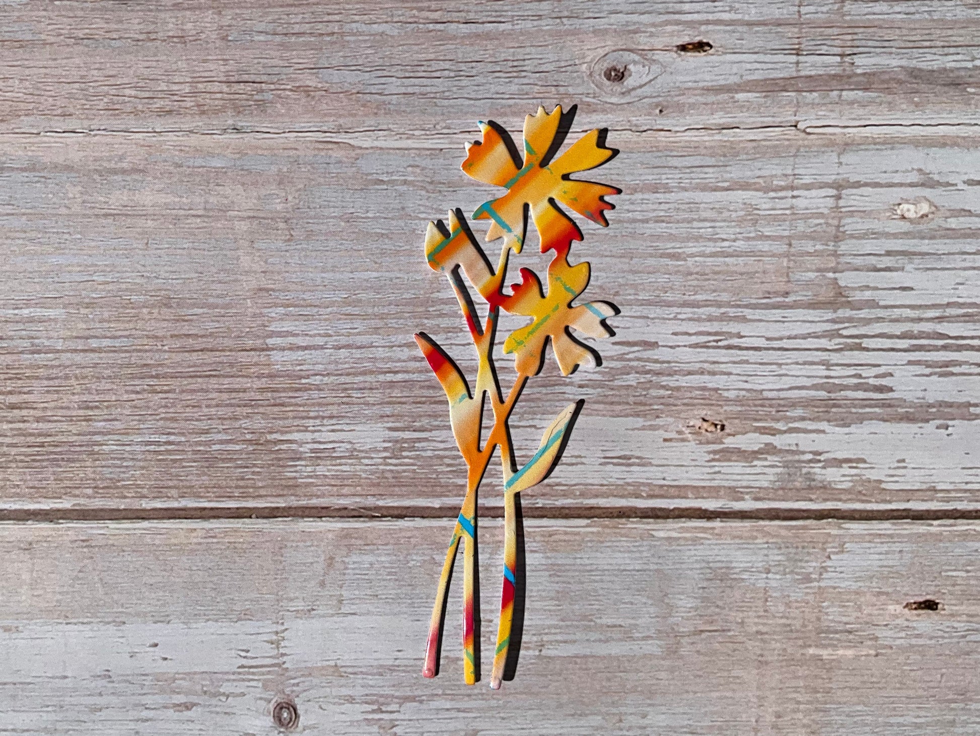 Pink and orange patterned vinyl sticker in the shape of cornflowers