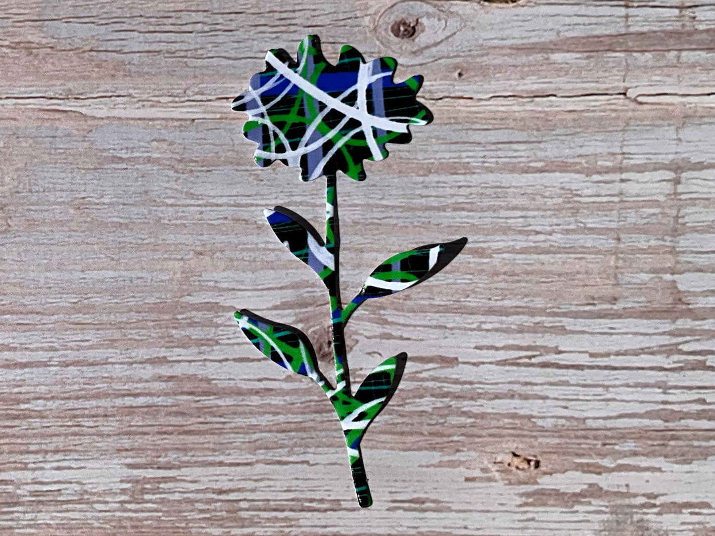 Blue white green pattern on a vinyl sticker shaped like a sunflower