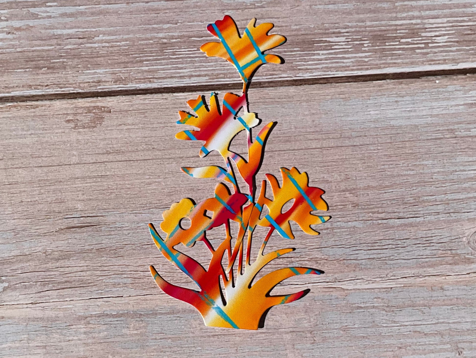 Colourful flowers sticker on a wooden surface