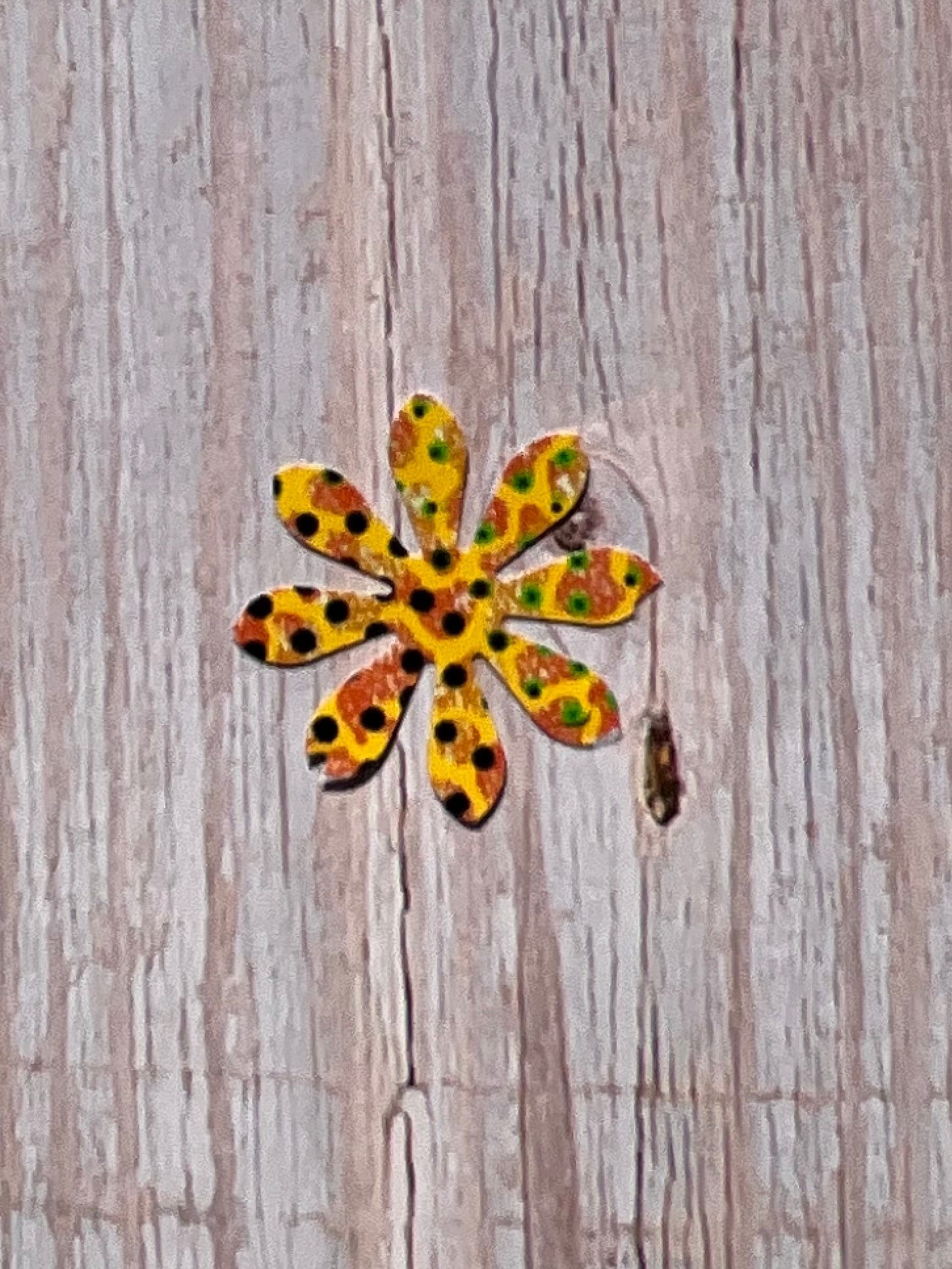 Yellow and lack spotted daisy flower vinyl sticker