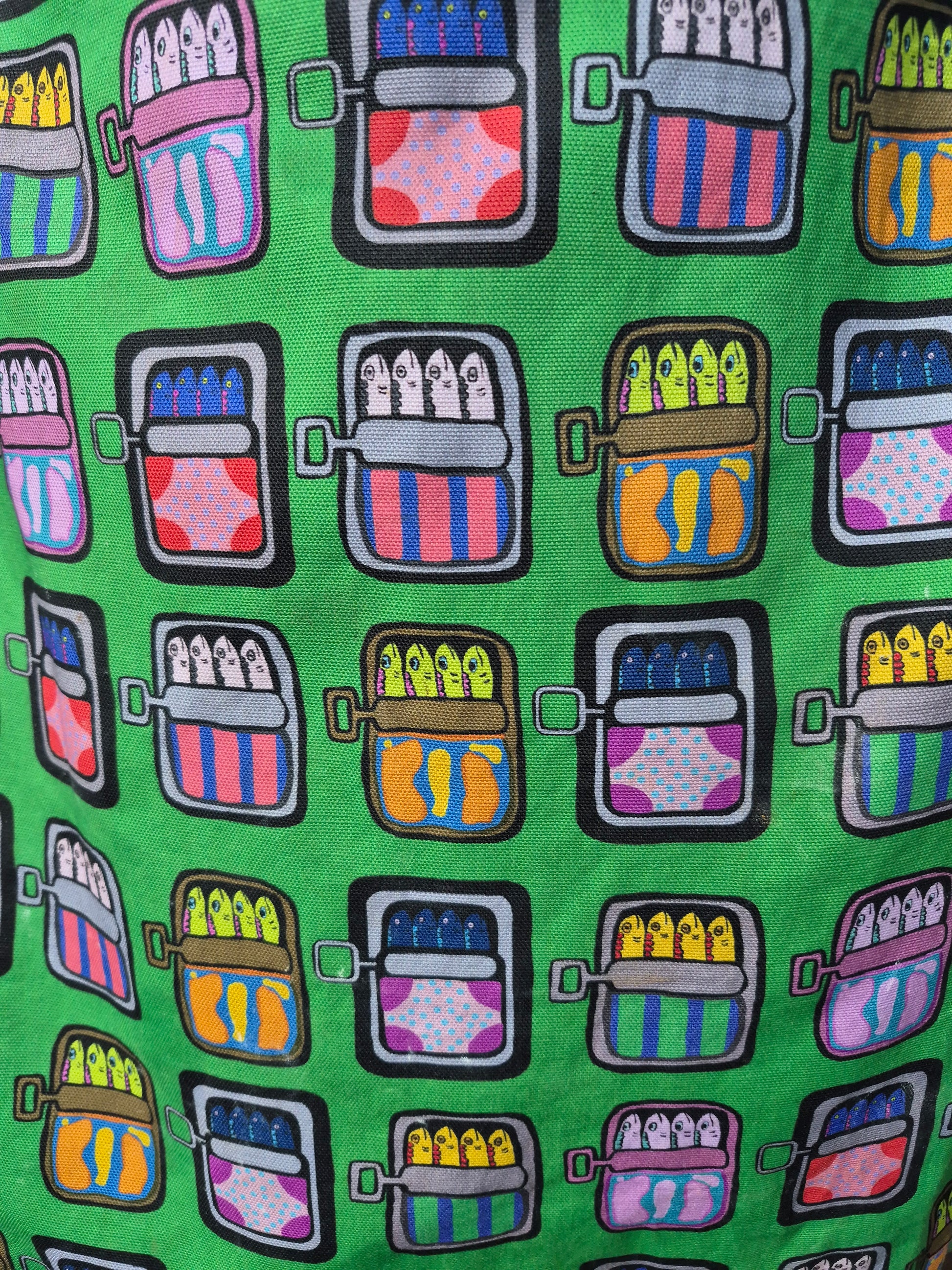 close up of green mackerel print tea towel