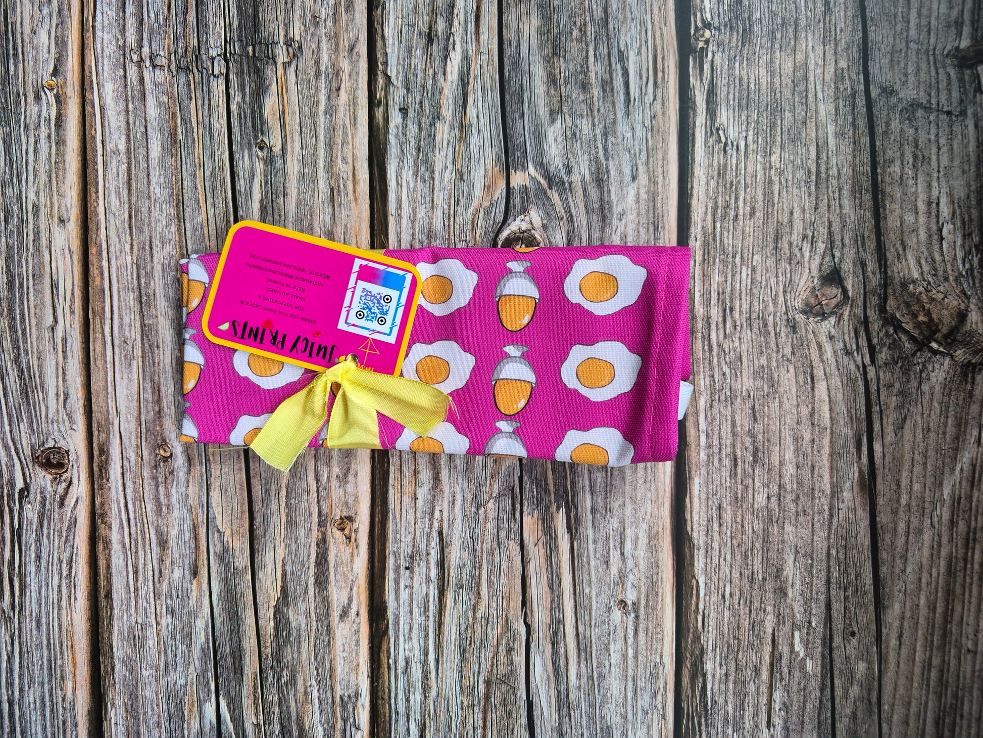 Pink egg print tea towel folded