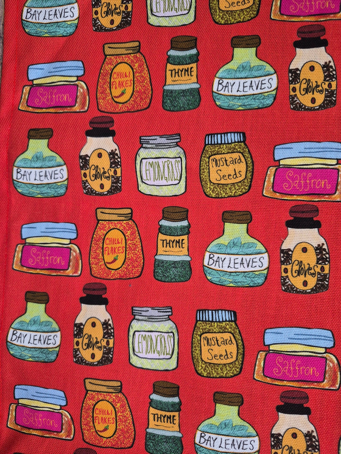 A close up of spice bottles illustrations on a red background